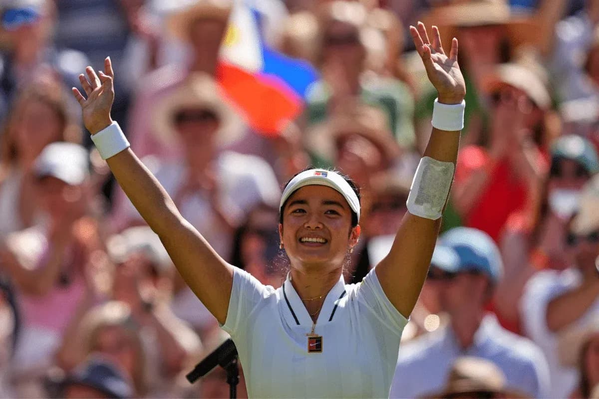 Tennis player celebrating with raised arms in crowd Tennis player celebrating with raised arms in crowd
