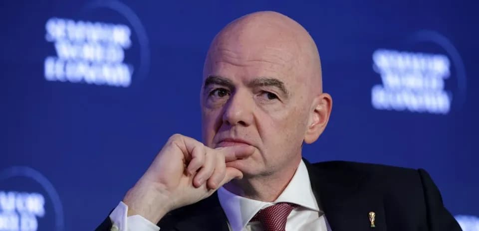 Man with hand on chin at conference