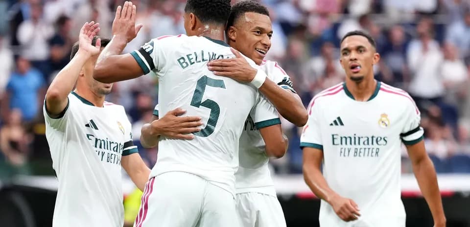 Real Madrid players celebrating a goal on the pitch