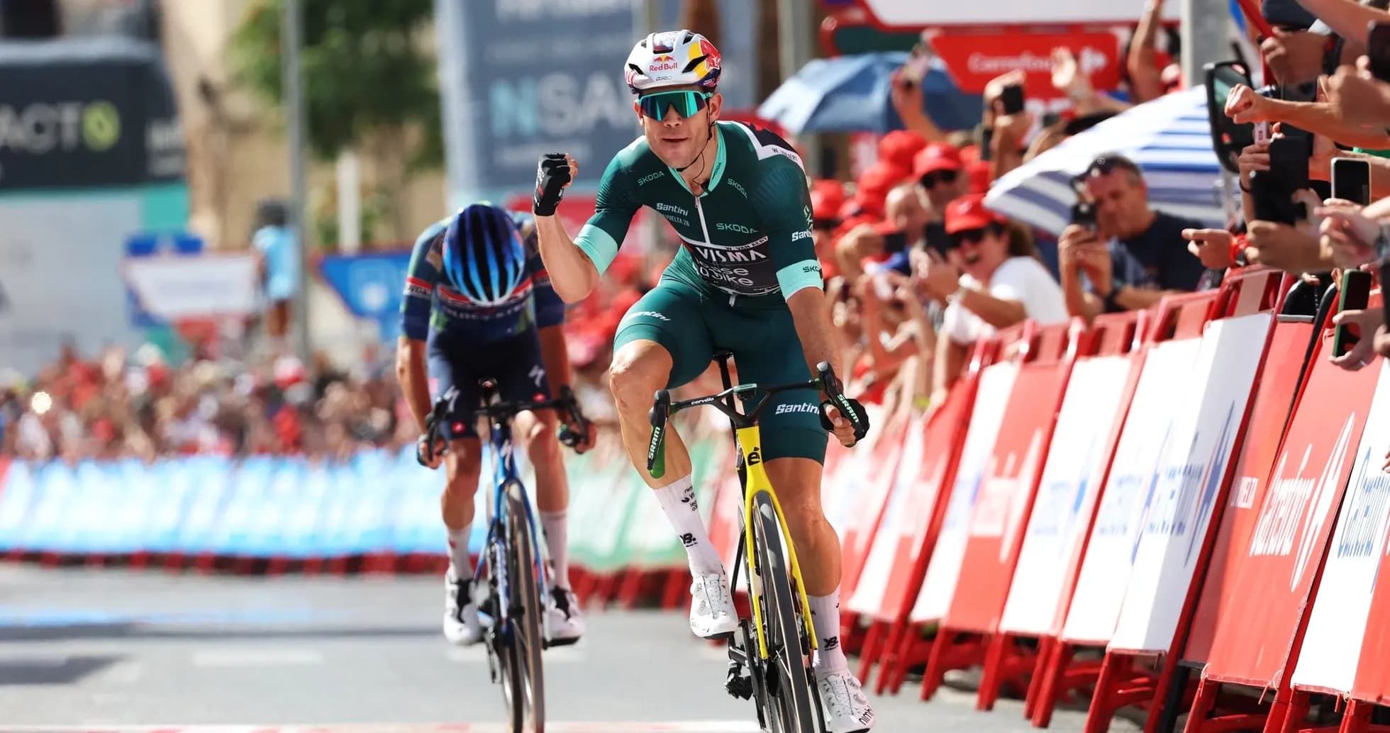 Cyclist celebrating victory at the finish line