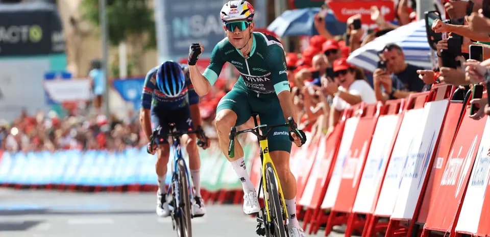 Cyclist celebrating victory at the finish line