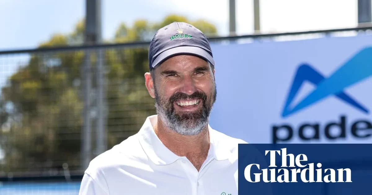 Tennis coach smiling at padel event outdoors