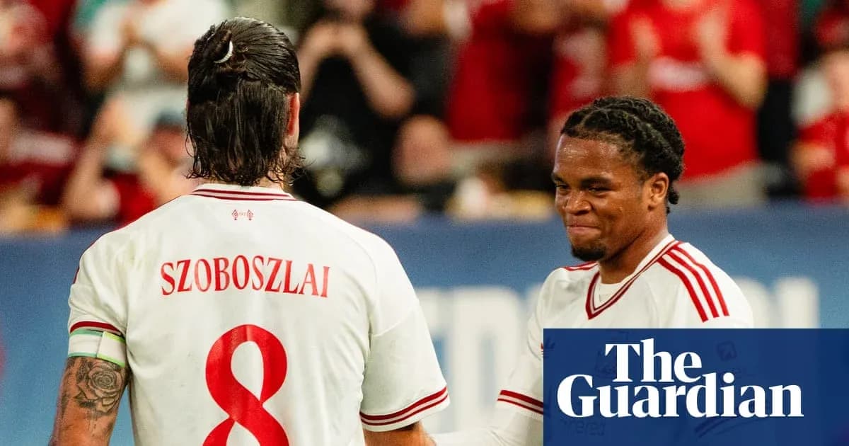 Duo celebrating during football match on field Duo celebrating during football match on field