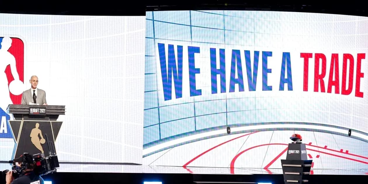 NBA official announcing trade at draft event NBA official announcing trade at draft event