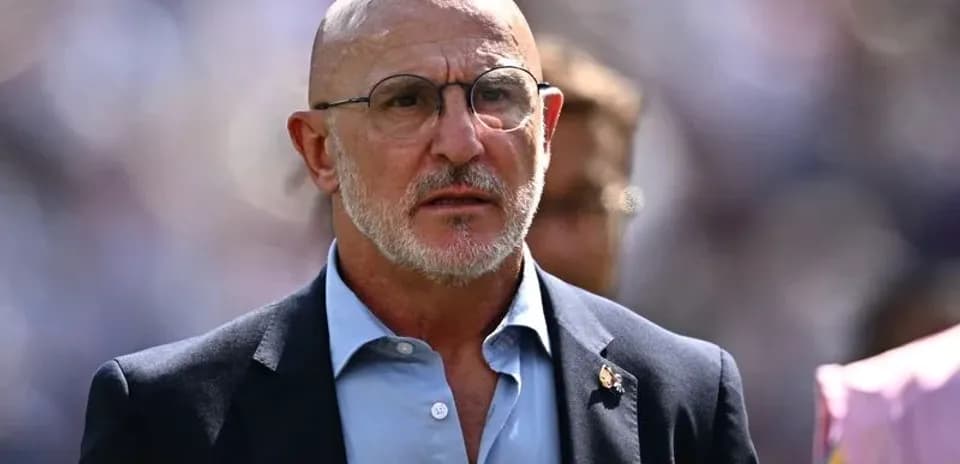 Bald man in glasses walking in stadium