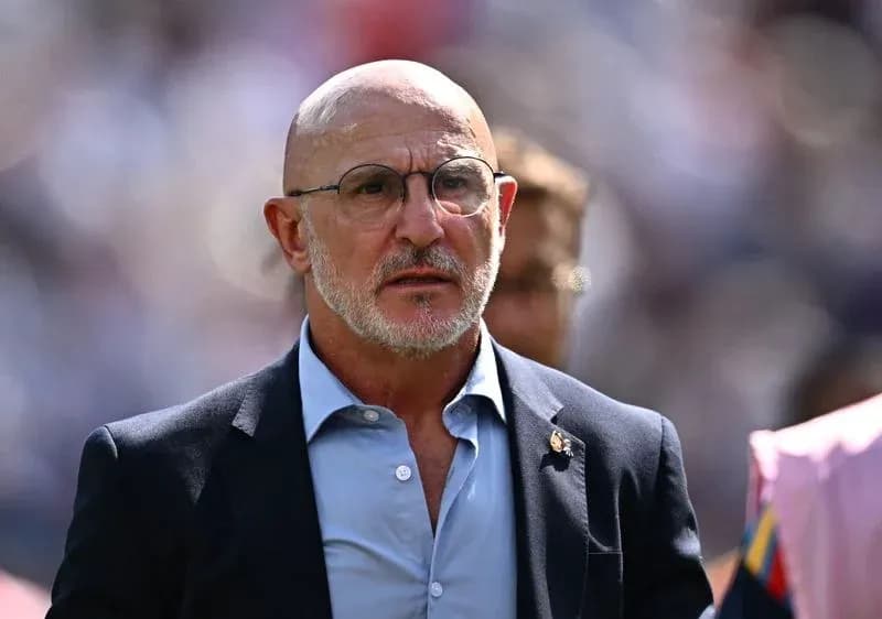 Bald man in glasses walking in stadium