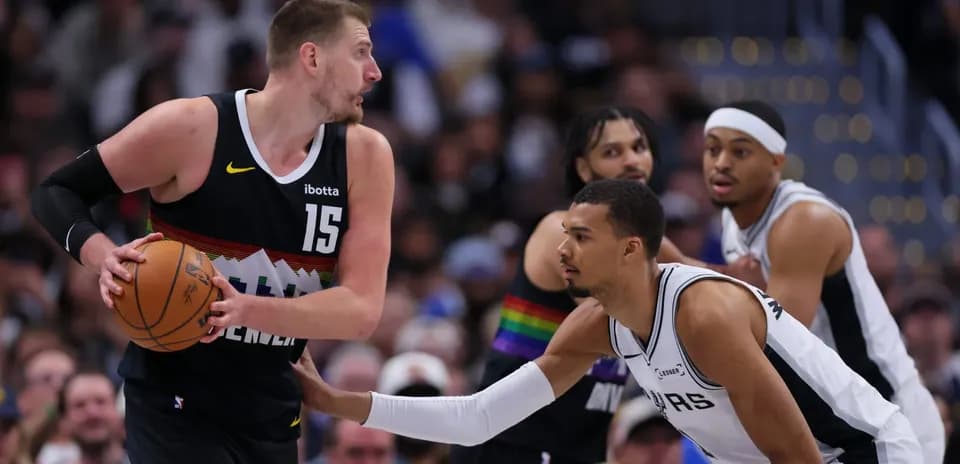 Nikola Jokic dribbling the ball during game action