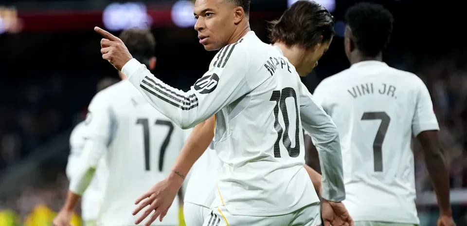 Kylian Mbappé celebrating with teammates after scoring