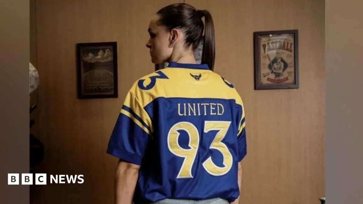 Player wearing blue and yellow jersey with 'United 93'