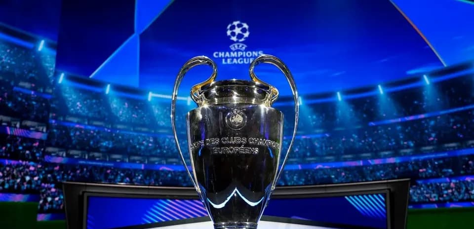 Champions League trophy displayed on stage