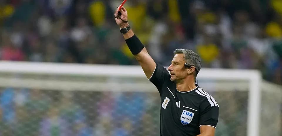 Referee showing a red card during a match