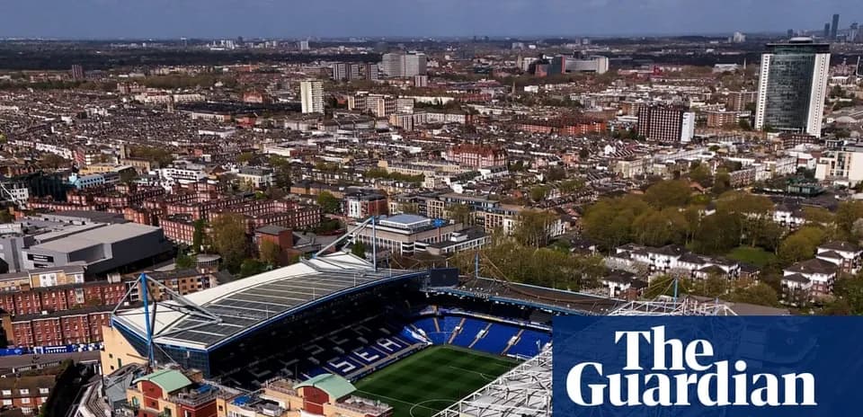 Aerial view of a football stadium and city