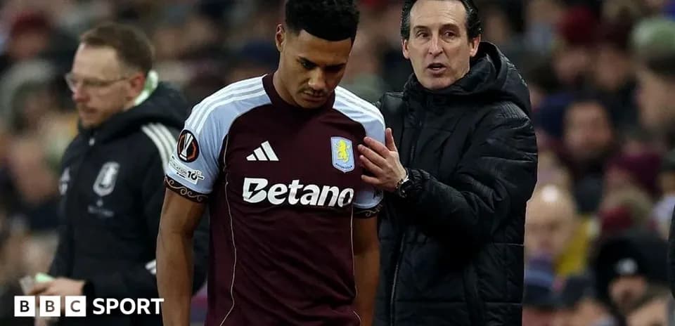 Aston Villa player receiving guidance from coach
