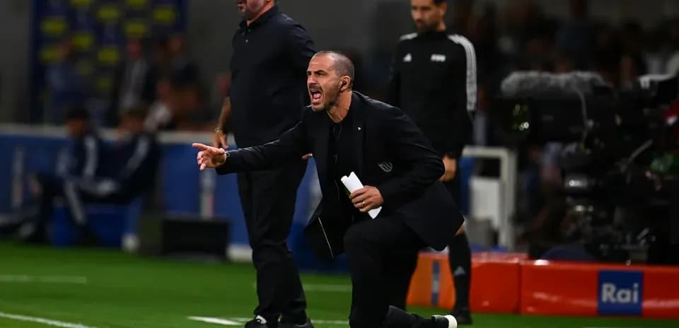 Trainers coaching from the sidelines during match