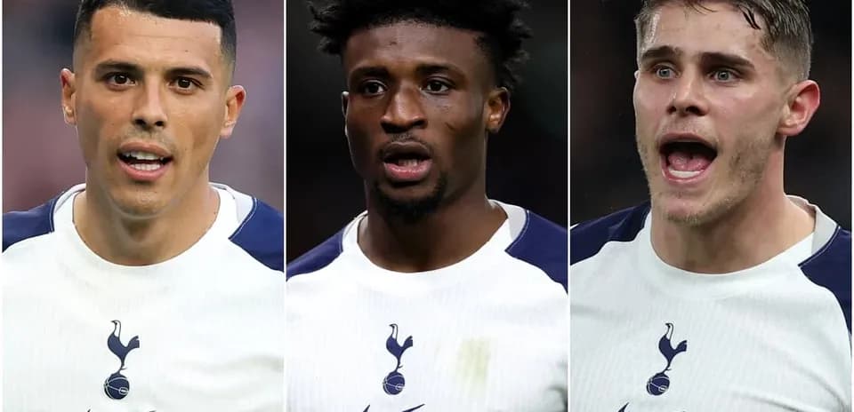 Three Tottenham players in white jerseys during match