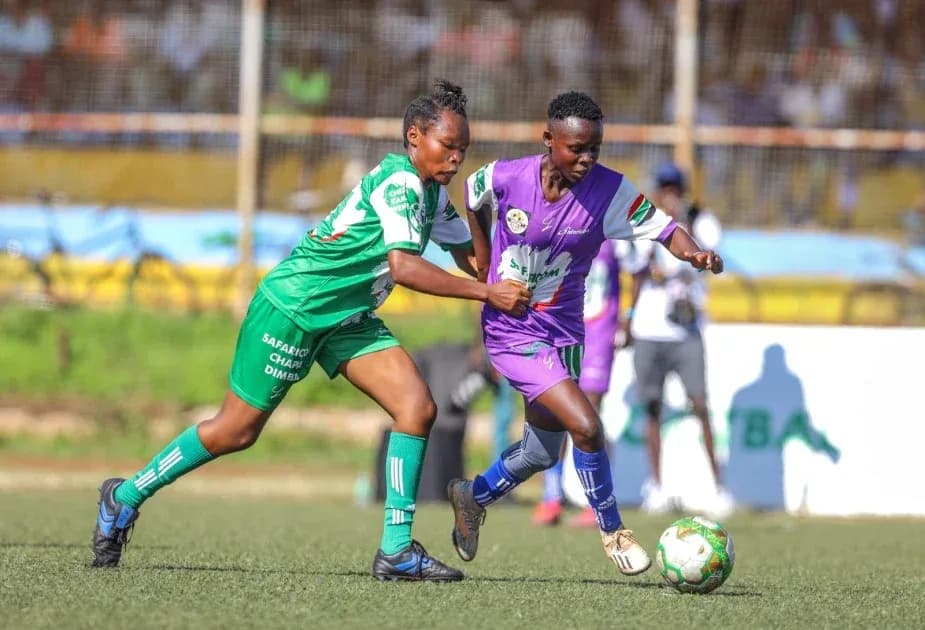 Two players competing for the ball in match