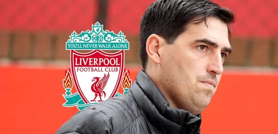 Person in front of Liverpool FC logo background
