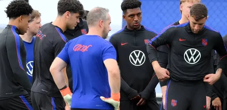 US national team players in training session huddle