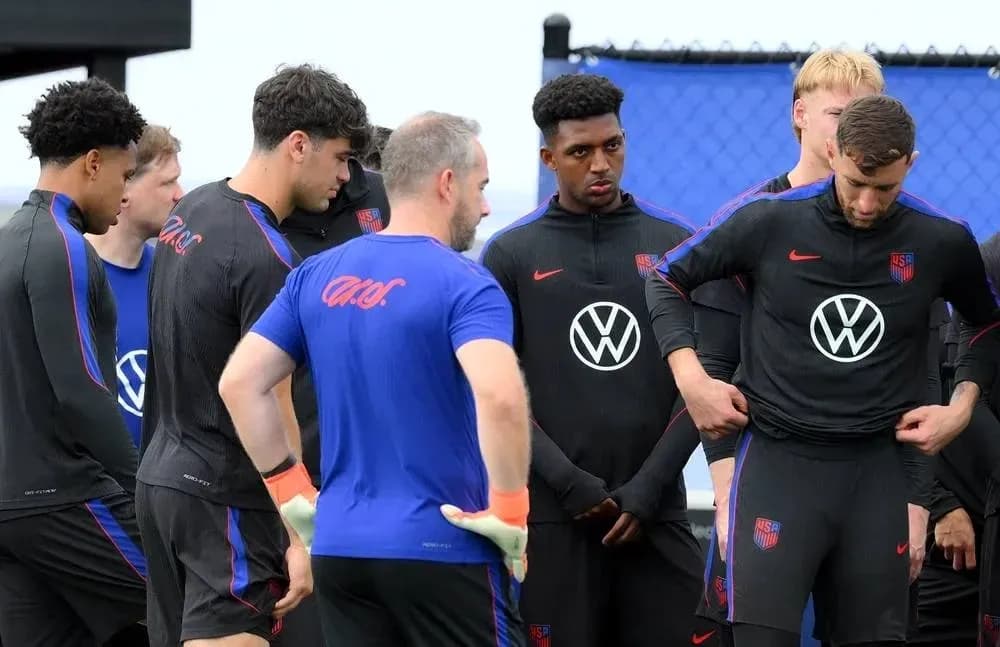 US national team players in training session huddle