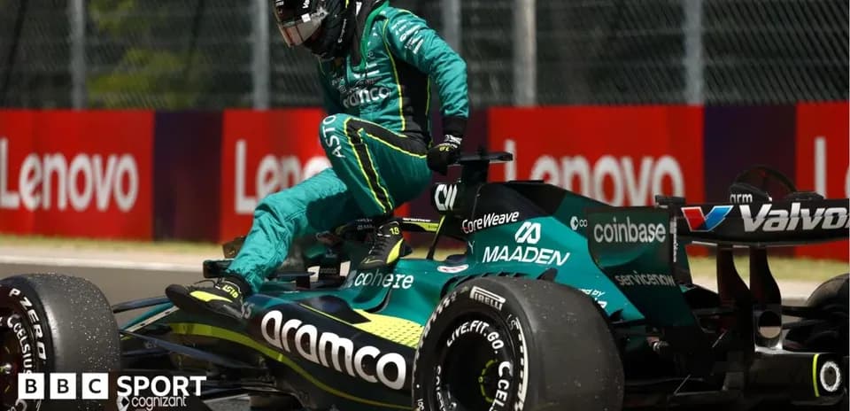 Driver exiting Aston Martin F1 car during race