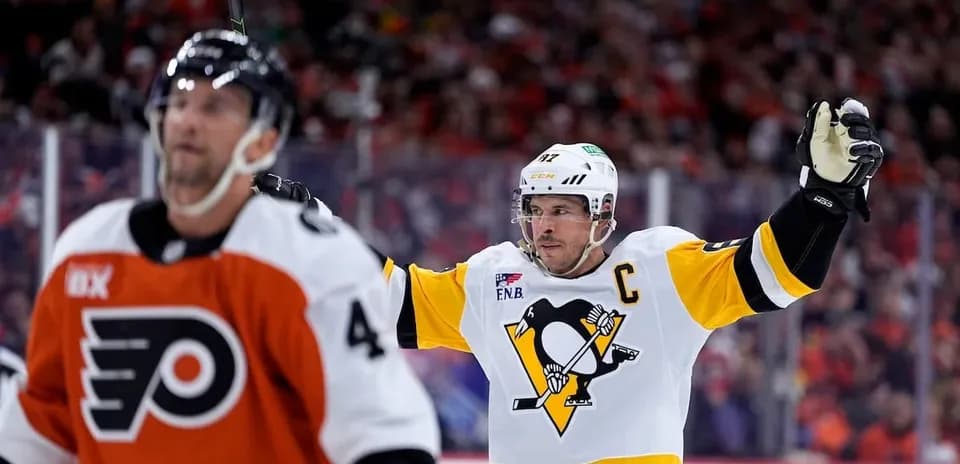 Pittsburgh Penguins player celebrating a goal against Flyers