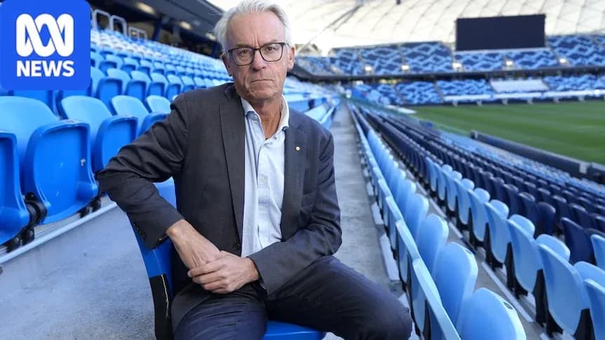 Man sitting in empty stadium seats