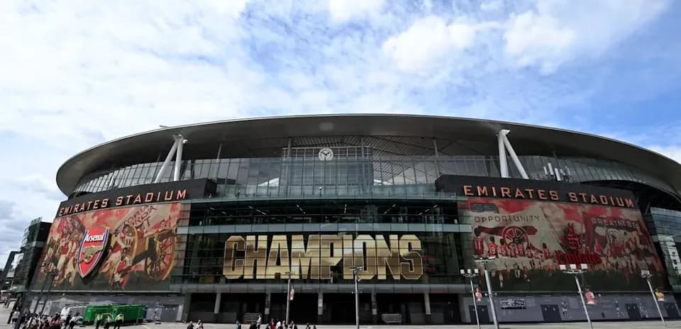 Emirates Stadium exterior with Champions banner