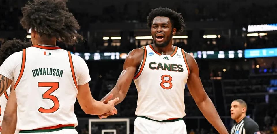 Miami players celebrating during NCAA basketball game
