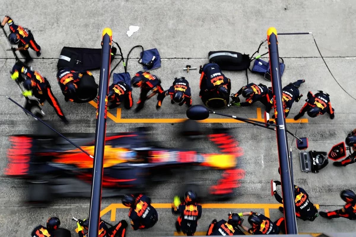 Red Bull Racing pit crew during a tire change Red Bull Racing pit crew during a tire change