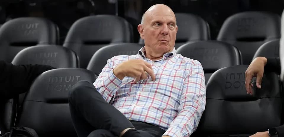 Man sitting in arena seats during game