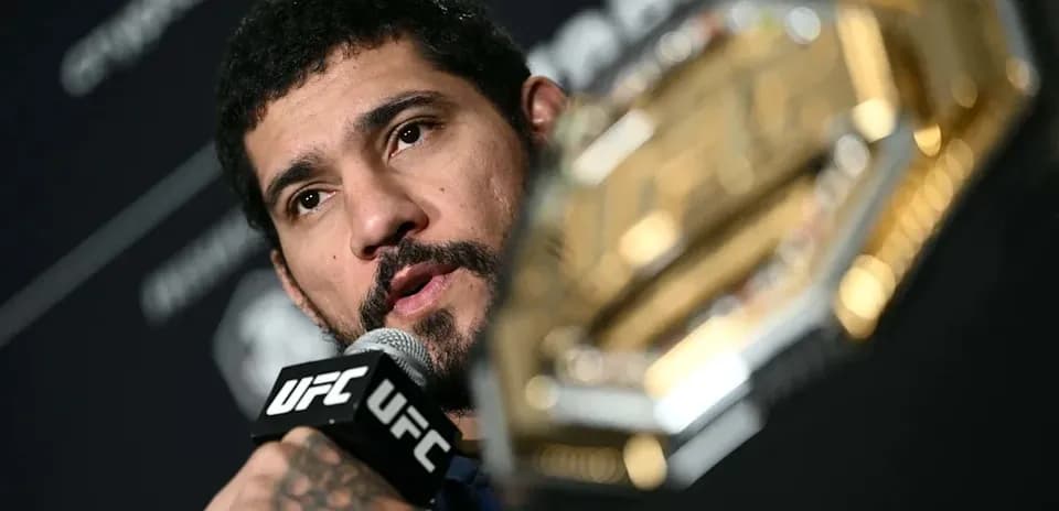 Fighter speaking into microphone during press conference