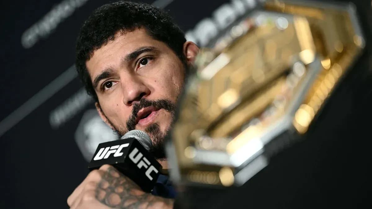 Fighter speaking into microphone during press conference