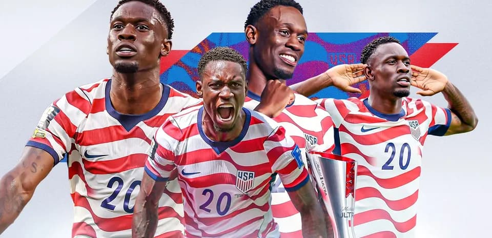 USA soccer player celebrating with trophy and poses