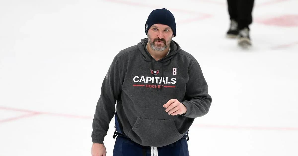 Hockey coach on ice during practice session