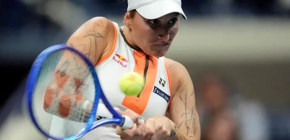 Tennis player hitting a forehand shot in match