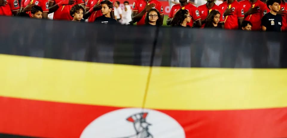 Ugandan players and children during national anthem ceremony