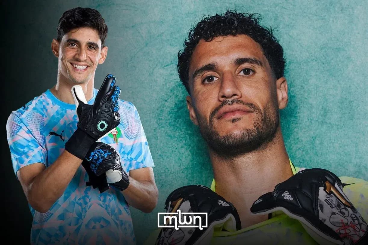 Two goalkeepers posing with gloves and smiles