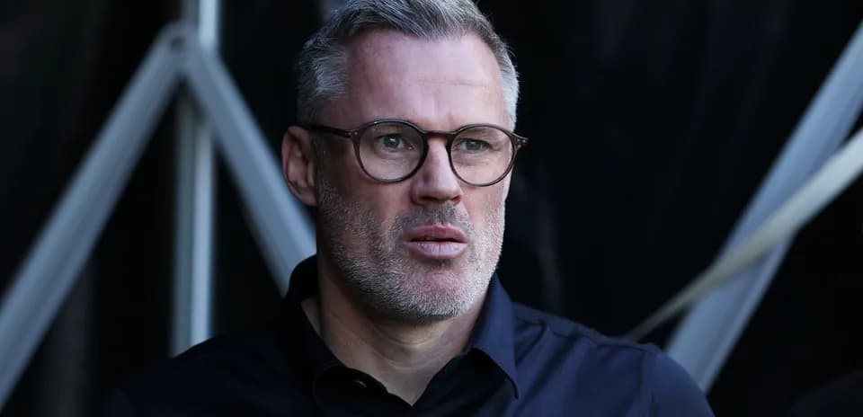 Person with glasses looking thoughtfully at the camera