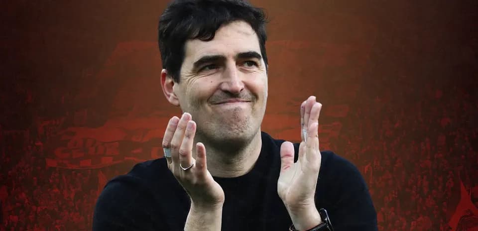 Men coach applauding during a football match