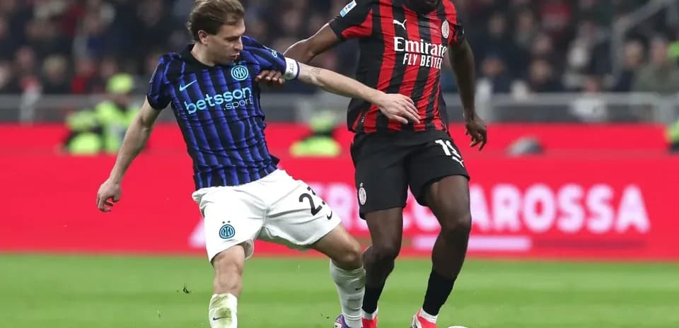Two players contesting for the ball during match