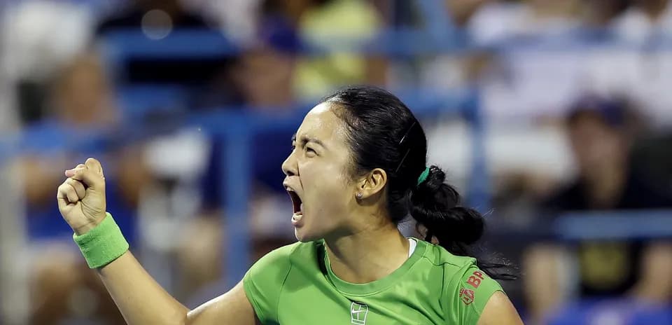 Tennis player celebrating with fist pump during match