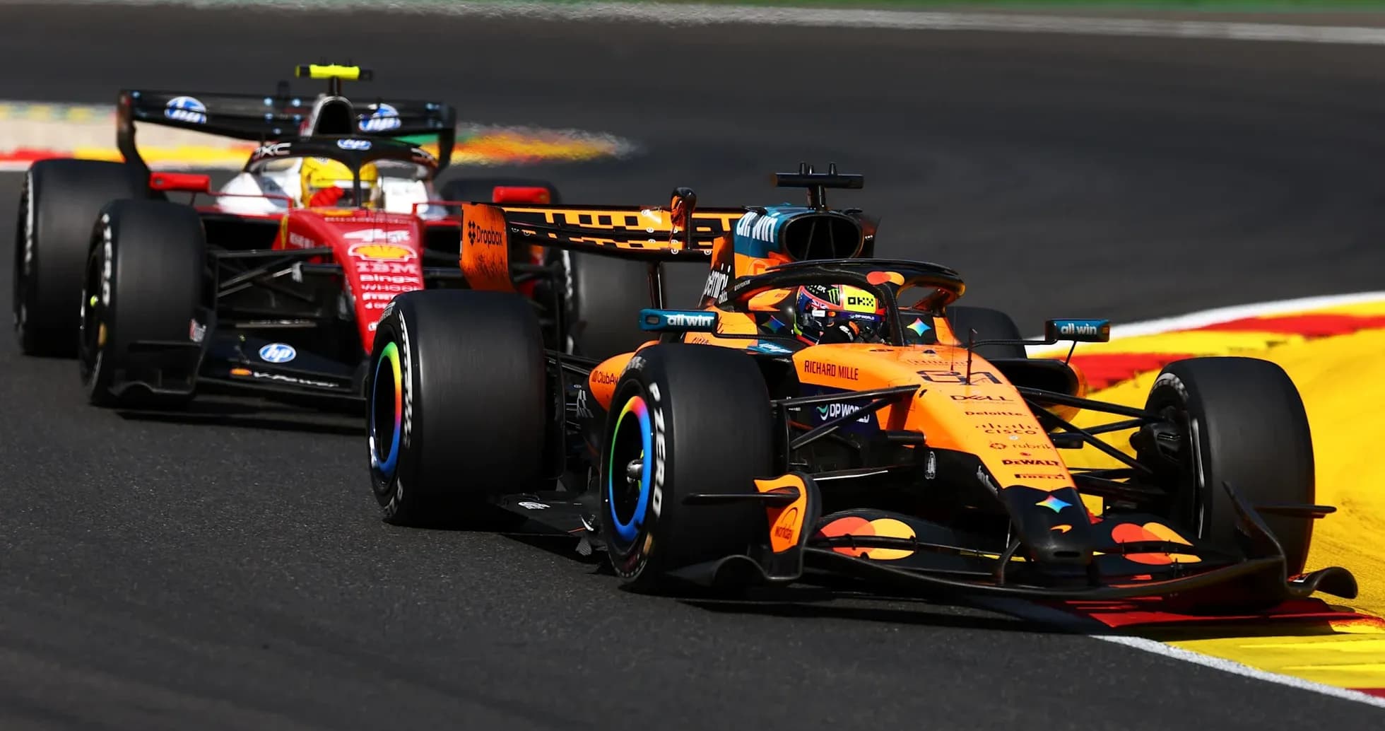 McLaren and Ferrari cars racing on track