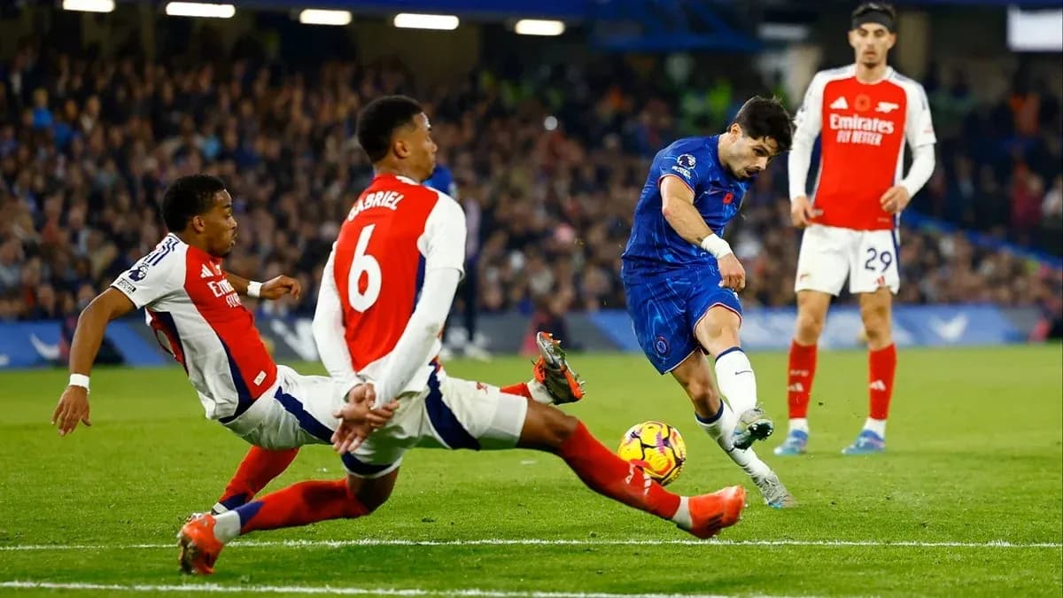 Chelsea player attempting to shoot during match against Arsenal