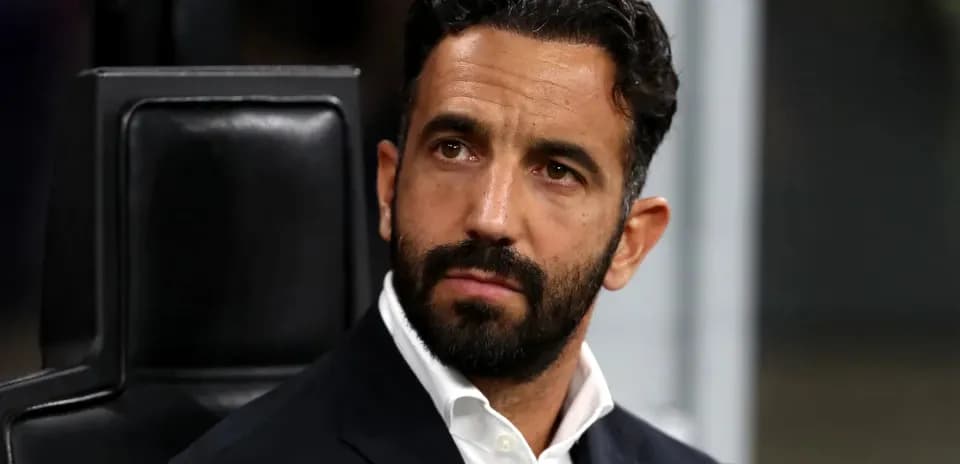 Men's football coach sitting on the bench