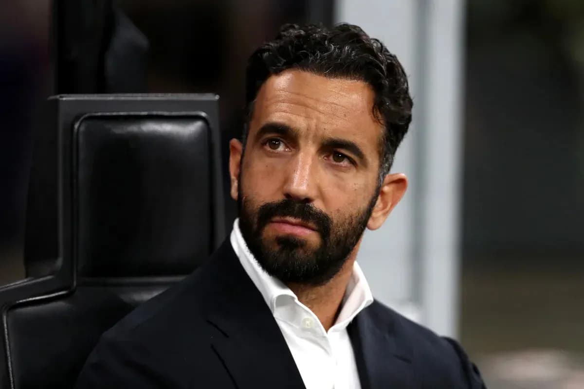 Men's football coach sitting on the bench