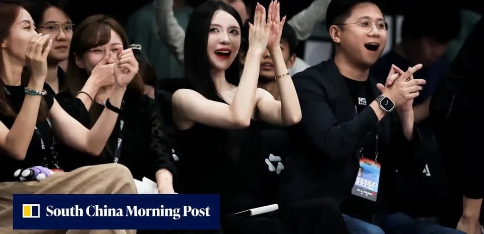 Spectators cheering and clapping at event