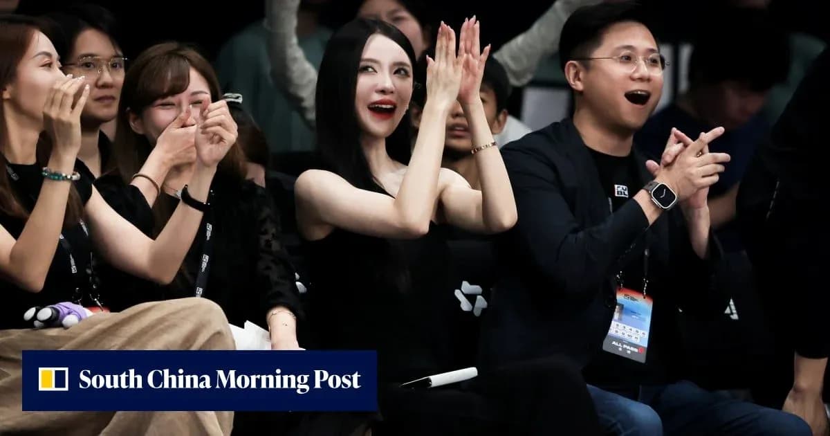 Spectators cheering and clapping at event