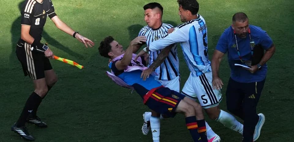 Players clashing during intense football match action