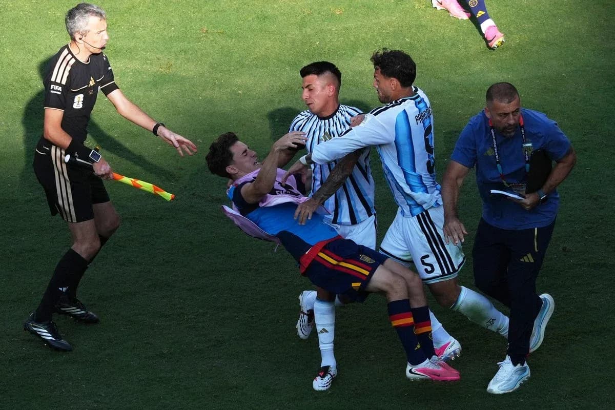Players clashing during intense football match action