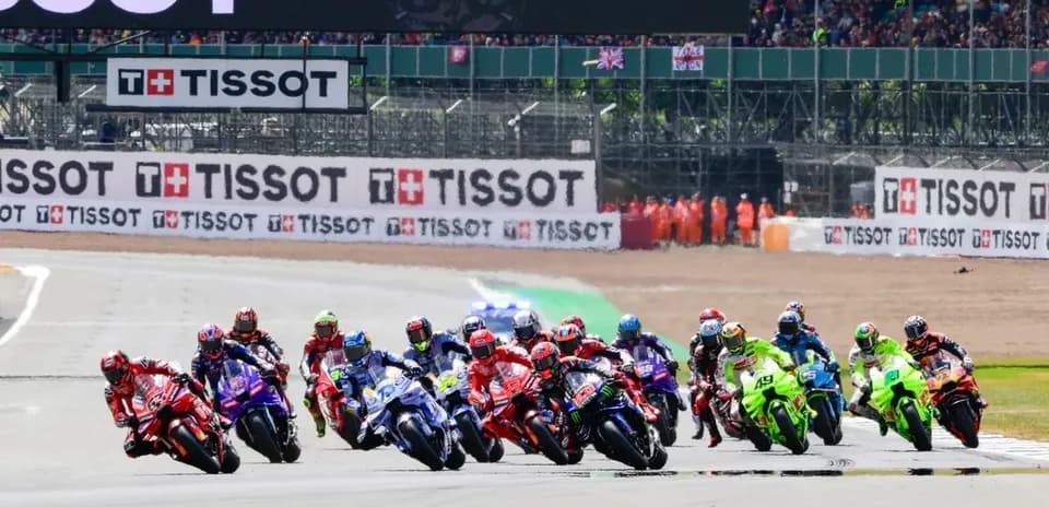Motorsport race with multiple bikes competing on track